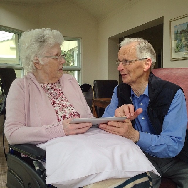 Mum and Dad – looking at photos of their garden on the iPad