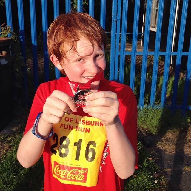 Delighted with his medal from completing the Lisburn Fun Run