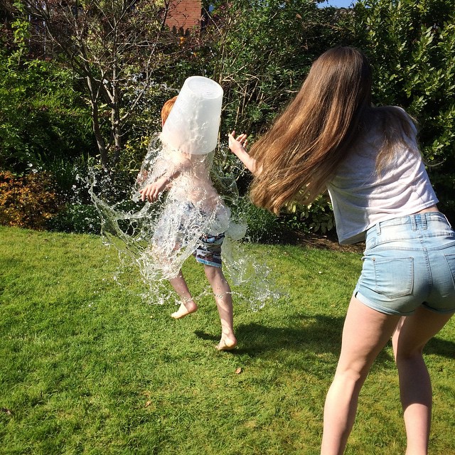 Water fun in the back garden – he did ask his sister to soak him!