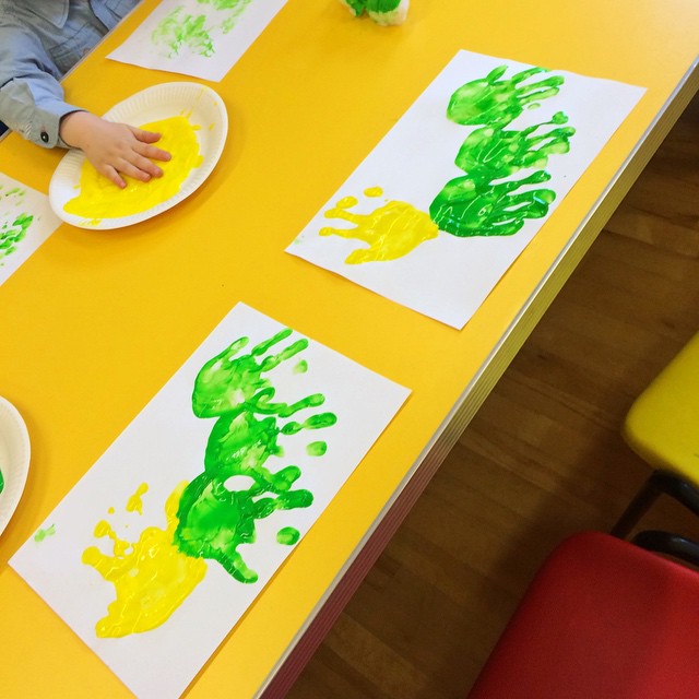 Messy fun creating handprint caterpillars at Toddler Group this morning