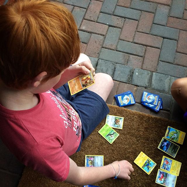 Playing with Pokemon on the front step