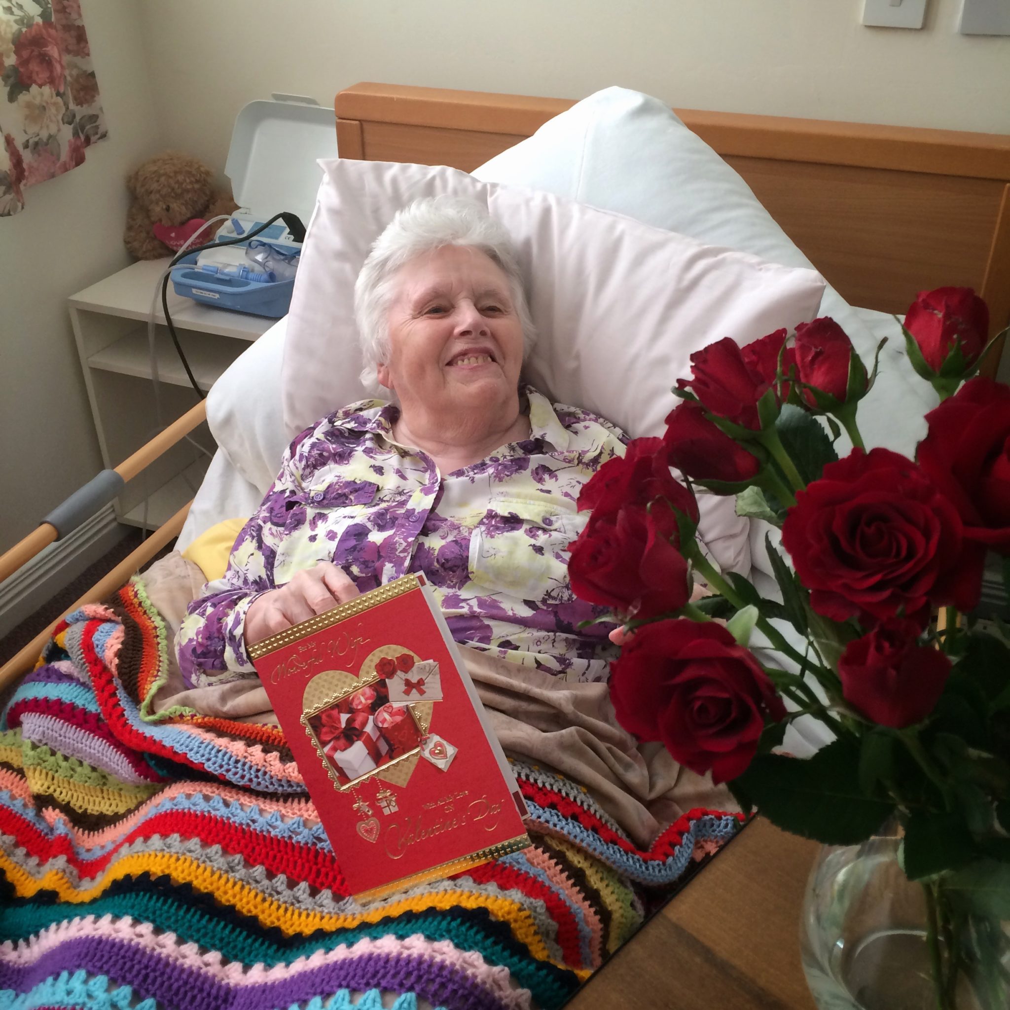 Mum enjoying her Valentine card and roses from Dad