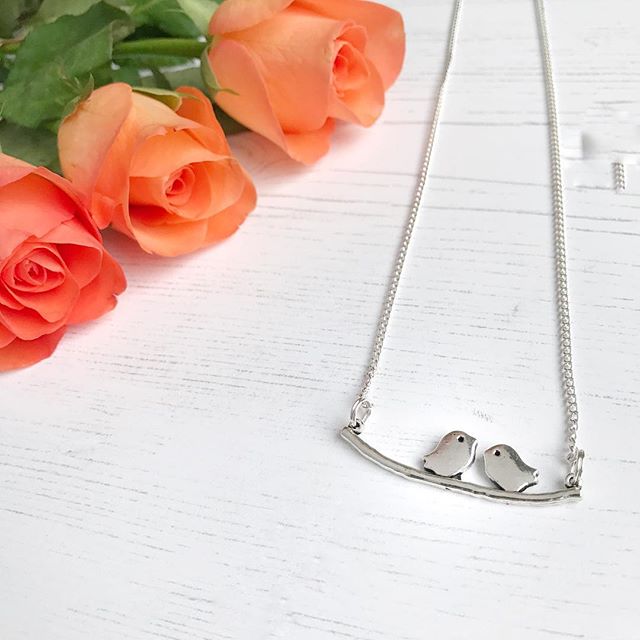 A twin bird pendant (from Janmary Designs) and some pretty roses